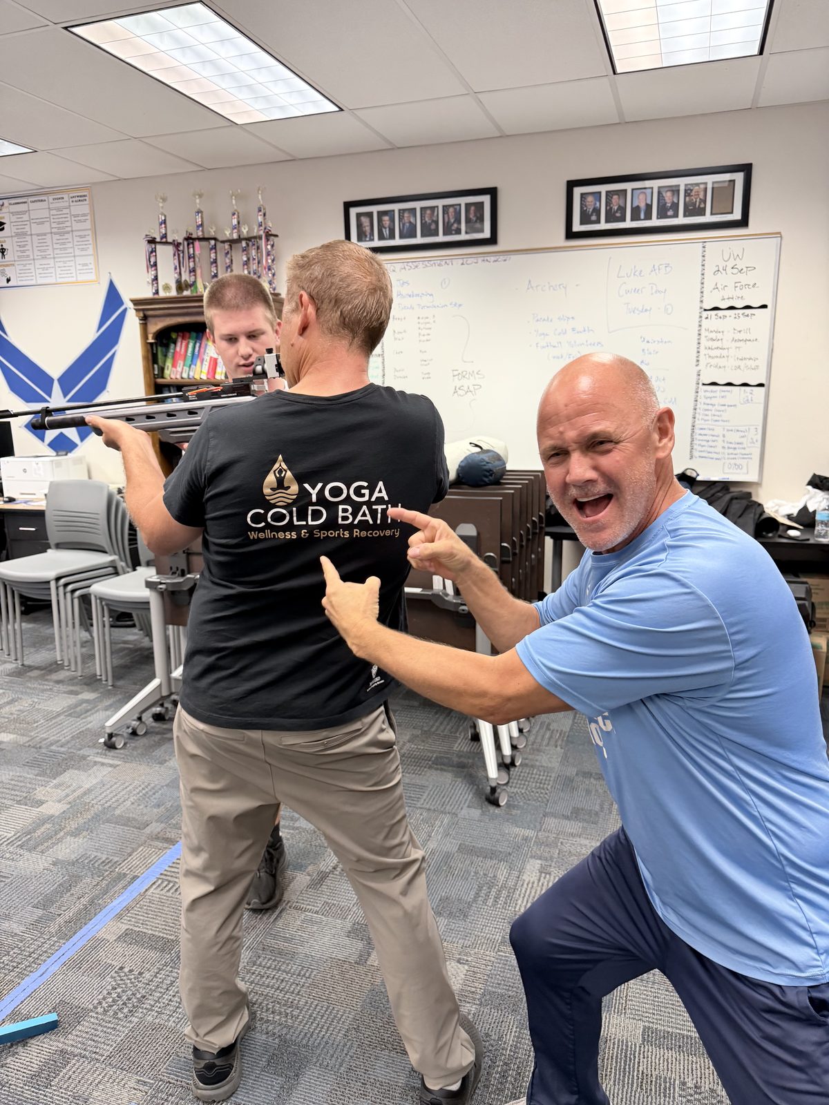 Instructor cheering on air rifle practice