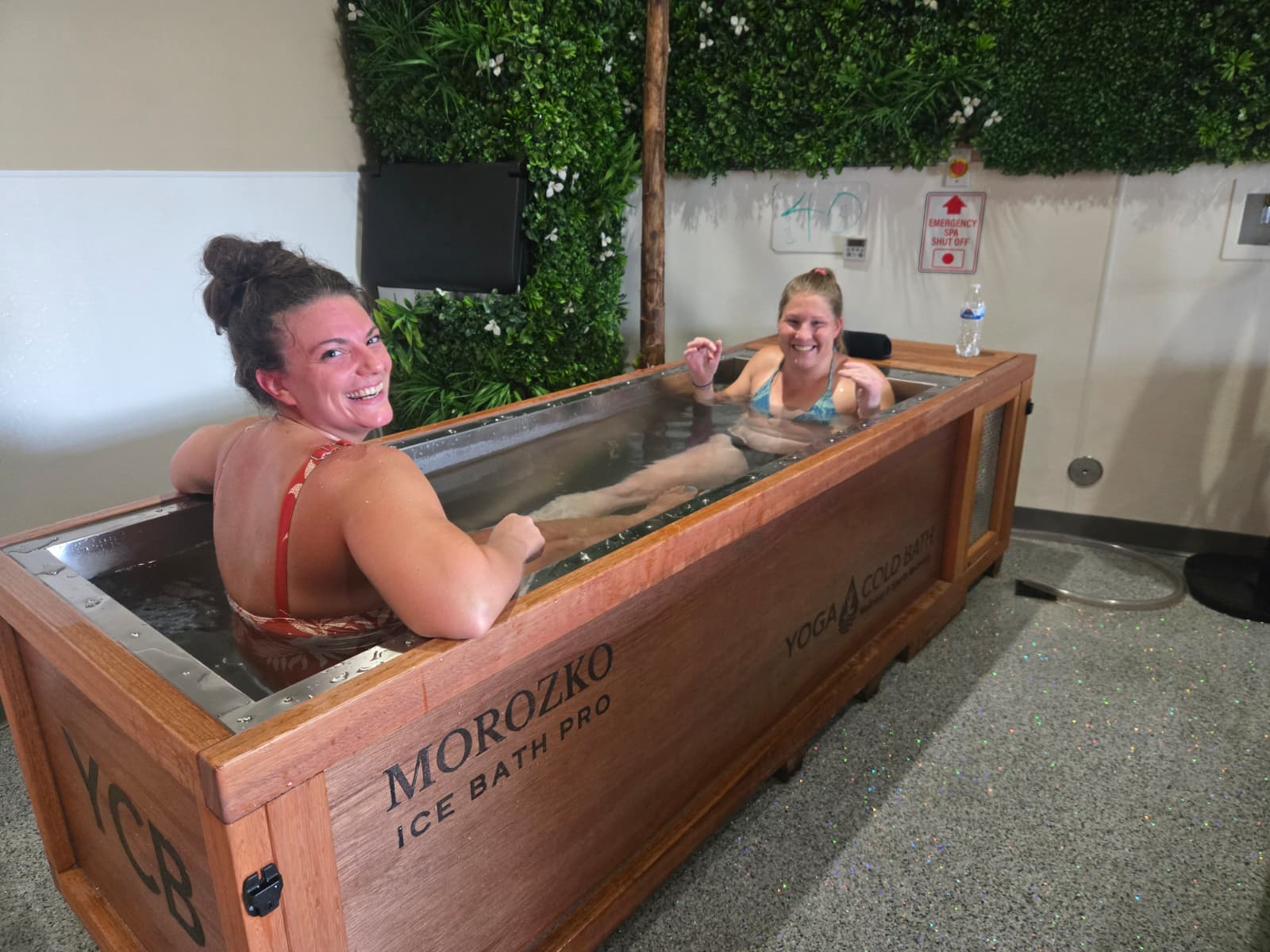 Two friends laughing in a Morozko ice bath at YCB