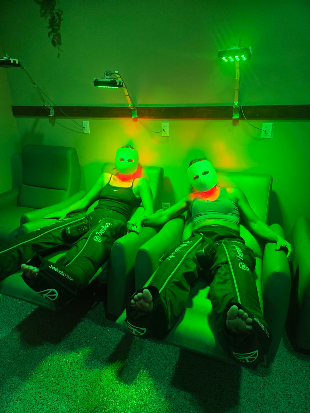 Members relaxing with JetBoots in the Green Light Room