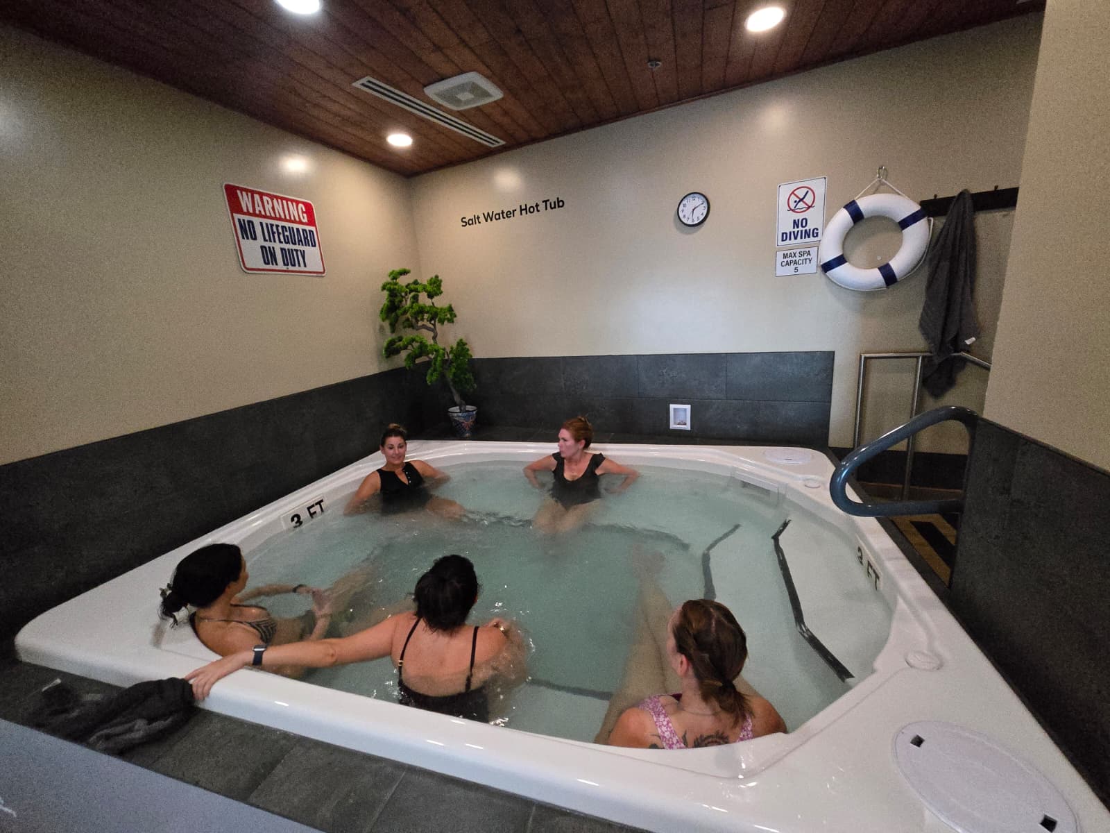 Members relaxing in the salt-water hot tub