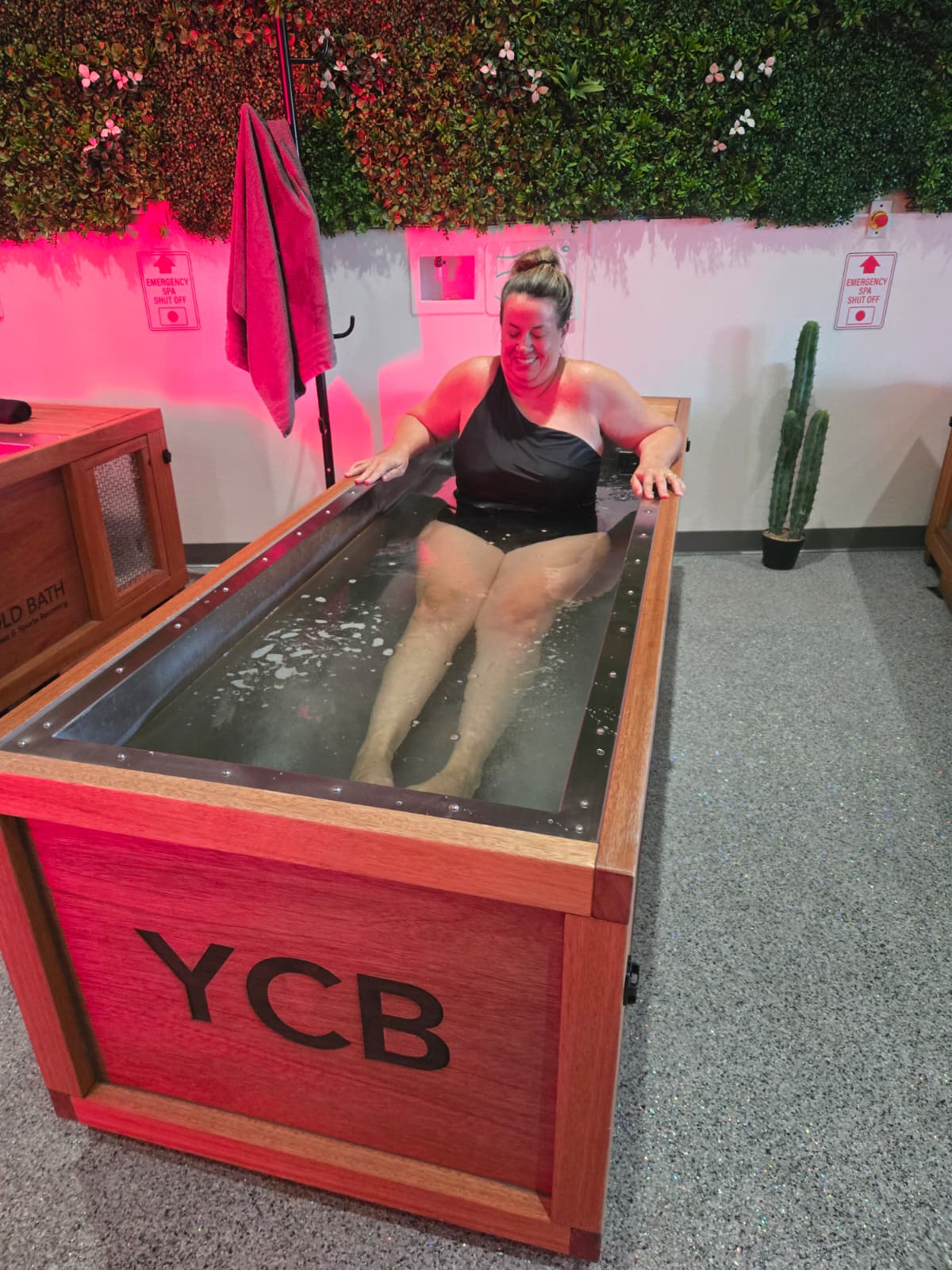 Member smiling in a crystal-clear YCB ice bath