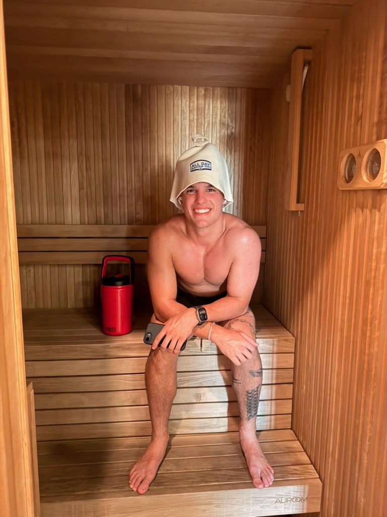 Member warming up in the sauna at Yoga Cold Bath